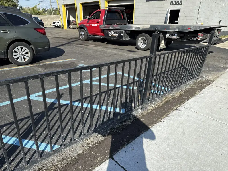Elite Detroit Towing red Ram flatbed parked at 8060 Tireman Ave shop in Detroit